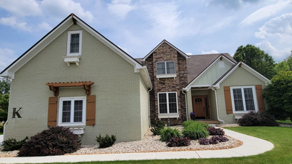James Hardie Borad and Batten siding and Boral versetta stone in Zionsville, IN
