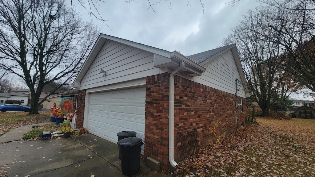 Featured Project: Garage view of an Indianapolis, IN home before getting new white gutters