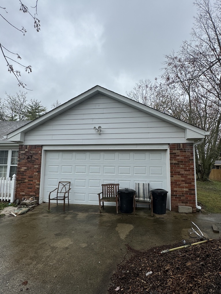 Featured Project: Garage view of an Indianapolis, IN home after getting new white gutters