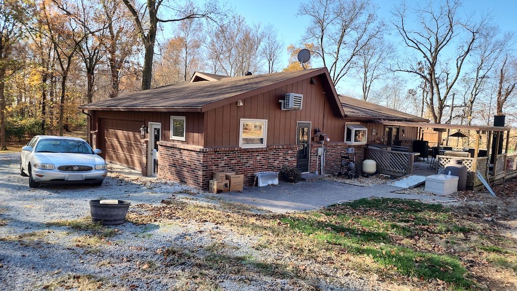 Featured Project: Back view of a Greenfield, IN home before new James Hardie siding