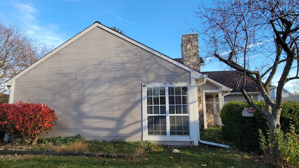 View of a new window on an Indianapolis home before a complete exterior transformation